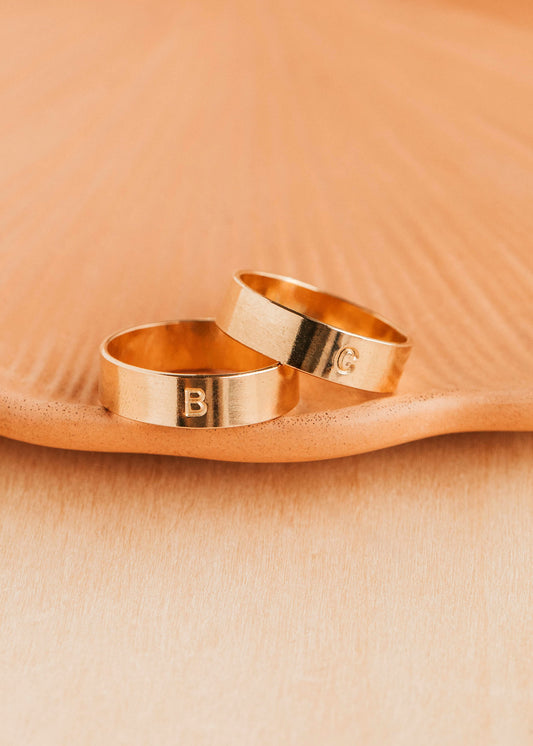 14K Gold Fill Bold Initial Band by Hello Adorn - two wide gold bands engraved with letters B and C on ceramic dish