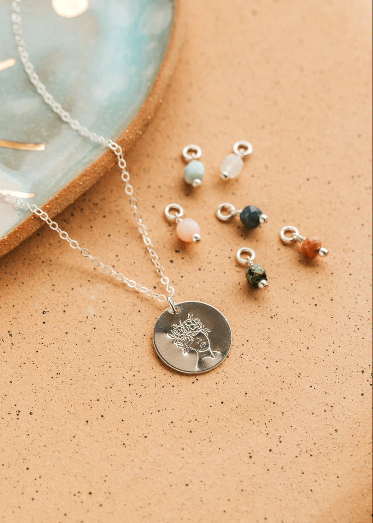 Sterling Silver Hello Adorn Mental Health necklace with circular pendants and meaning charms
