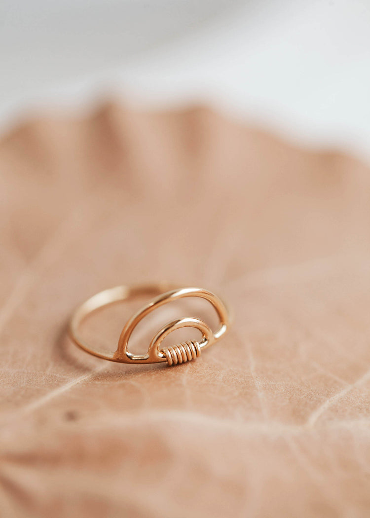 A double rainbow in 14k gold fill with a wire wrapped detail to create a wire wrapped ring by Hello Adorn in the Raye Ring style.