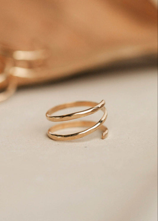 A wrap ring shown in 14k gold fill created using thicker wire to make it look like 2 rings together, handmade jewelry by Hello Adorn.