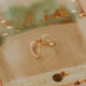 Gold ring on a textured ceramic surface