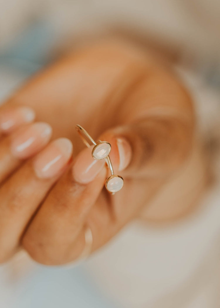 Close-up of a person holding rings with a blurred background