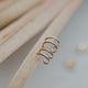 Small gold earring design in double up post style by Hello Adorn shown in 14k gold fill.