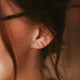 Gold bar stud earrings styled in an ear with tiniest bar studs by Hello Adorn.