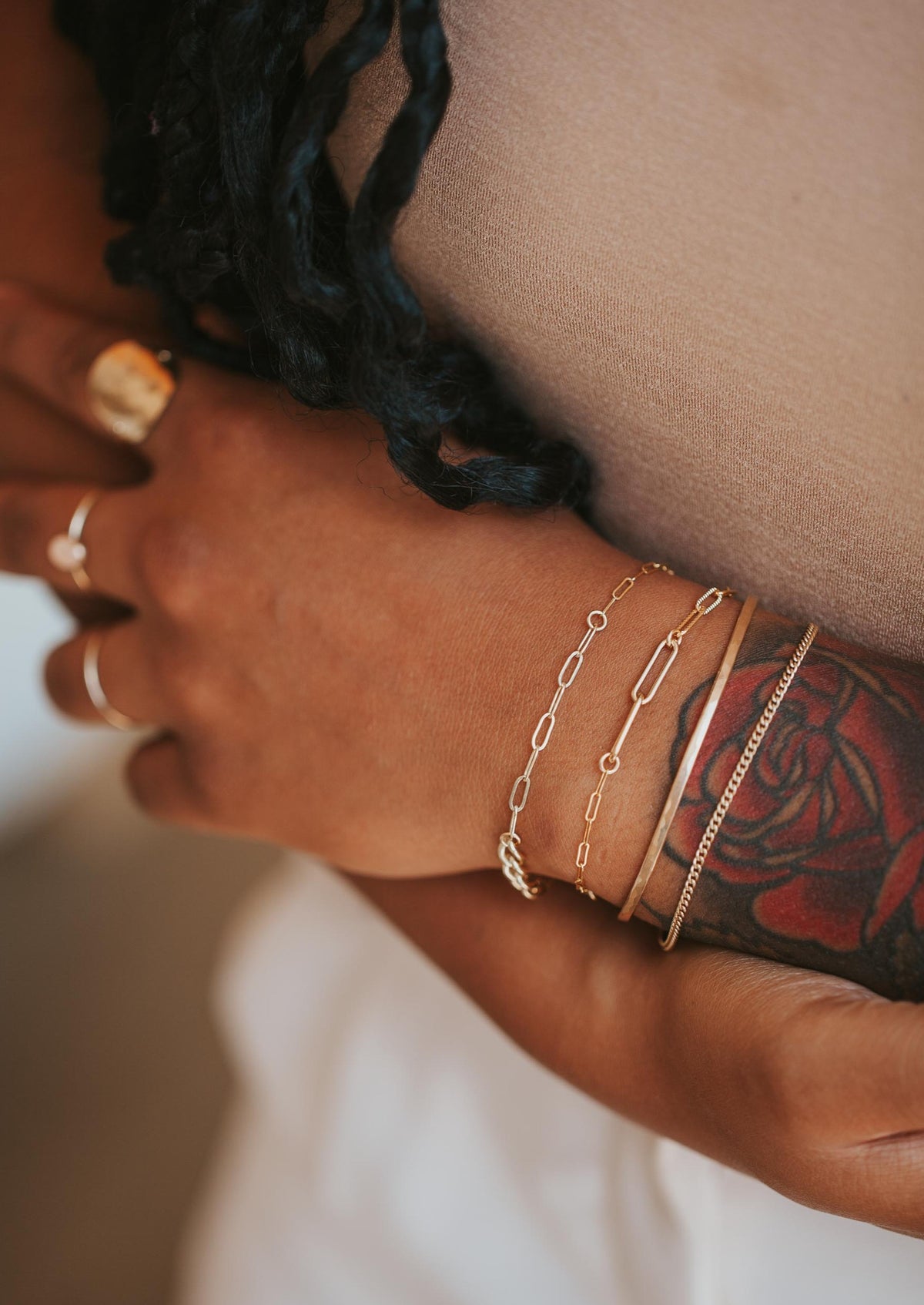 A cuff bracelet paired with two patchwork bracelets, this bracelet stack features mixed metal jewelry, patchwork bracelets are chain bracelets linked together to create a unique one-of-a-kind bracelet.
