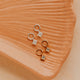 14K Gold Fill and Sterling Silver Grace Charms by Hello Adorn - CZ star charms on huggies on ceramic dish