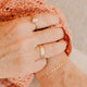 14K Gold Fill Bold Initial Band by Hello Adorn - worn on model's finger alongside Rosalie ring and stacked rings