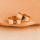 14K Gold Fill Bold Initial Band by Hello Adorn - two wide gold bands engraved with letters B and C on ceramic dish