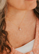 14K Gold Fill Rosalie Necklace by Hello Adorn - oval pink stone pendant worn on model's neckline with pink cardigan