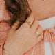 14K Gold Fill Rosalie Ring by Hello Adorn - styled on model's hand with gold signet cuff bracelet and chain