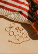 Hello Adorn Star Threader Earrings styled on a flat with other Americana props.