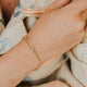 Model wearing free people jacket with dylan bracelet
