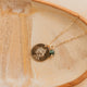 Gold Hello Adorn Mental Health necklace with circular pendants and meaning charms