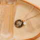 Gold Hello Adorn Mental Health necklace with circular pendants and meaning charms