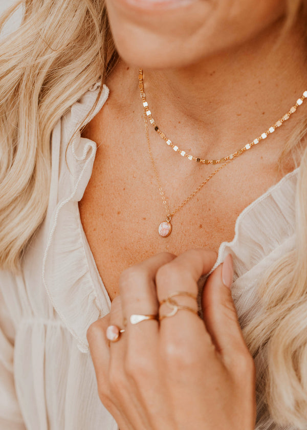 14K Gold Fill Rosalie Necklace by Hello Adorn - pink stone pendant layered with coin chain worn on model's chest