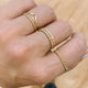 A ring stack curated by Hello Adorn featuring a chain ring in the Dani Chain Ring style paired with stackable rings in Confetti Ring style and a 3 ring pack.