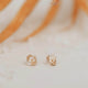 Close up view of herkimer diamond earrings by Hello Adorn shown in 14k gold fill.