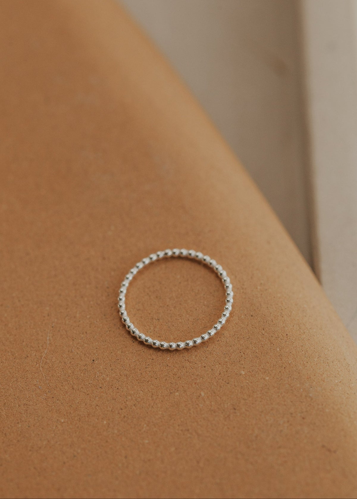 Silver beaded ring used for creating a ring stack using handmade jewelry by Hello Adorn.