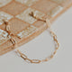A 14kt Gold Fill patterned link chain bracelet.