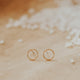 Gold circle earrings with an open circle earring style handmade by Hello Adorn for earrings for everyday wear shown in 14k gold fill.