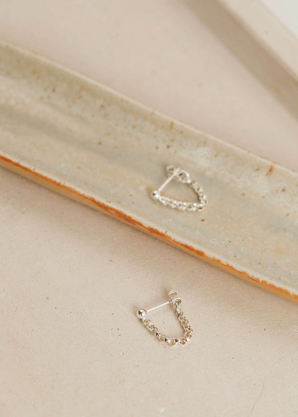 Earrings with hanging chain shown in sterling silver by Hello Adorn in mini annex style.