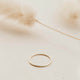 Gold Tenny-Tiny Band perfect for creating a ring stack by Hello Adorn.