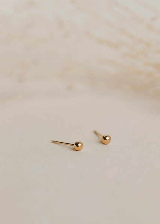 Gold ball earrings in a stud earring style created for everyday earrings or complete your earring stack with these gold small stud earrings by Hello Adorn.